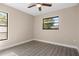 Bedroom with ceiling fan and large window at 2139 Abby Ave, Spring Hill, FL 34609