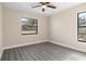 Bright bedroom with ceiling fan and new flooring at 2139 Abby Ave, Spring Hill, FL 34609