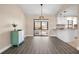 Bright dining room features wood-look floors and sliding glass doors at 2139 Abby Ave, Spring Hill, FL 34609