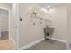 Laundry room with utility sink and shelving at 2139 Abby Ave, Spring Hill, FL 34609