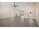 Spacious living room with high ceilings, wood-look floors, and an open floor plan at 2139 Abby Ave, Spring Hill, FL 34609
