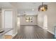 Bright living room with light wood-look floors and an open floor plan at 2139 Abby Ave, Spring Hill, FL 34609