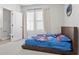 Bright bedroom featuring a comfortable bed and ample natural light at 2511 N Grady Ave # 26, Tampa, FL 33607