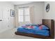 Spacious bedroom with large windows and plush carpeting at 2511 N Grady Ave # 26, Tampa, FL 33607