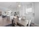 Bright dining room with a contemporary table and chairs, adjacent to the kitchen at 2511 N Grady Ave # 26, Tampa, FL 33607