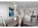 Elegant dining room with a trestle table and modern chandelier, open to the kitchen at 2511 N Grady Ave # 26, Tampa, FL 33607