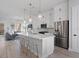 Spacious kitchen featuring white cabinets, stainless steel appliances, and an island at 2511 N Grady Ave # 26, Tampa, FL 33607