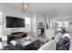 Open living area with comfortable seating, a large TV, and ample natural light at 2511 N Grady Ave # 26, Tampa, FL 33607