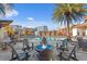 Inviting fire pit and chairs around a sparkling pool at 2511 N Grady Ave # 26, Tampa, FL 33607