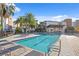 Community pool with lounge chairs and covered patio area at 2511 N Grady Ave # 26, Tampa, FL 33607