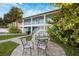 Private backyard with patio furniture and walkway at 2601 Bay Blvd, Indian Rocks Beach, FL 33785