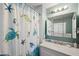 Clean bathroom with updated vanity and a relaxing shower/tub combo at 2601 Bay Blvd, Indian Rocks Beach, FL 33785