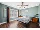 Charming bedroom with wood floors, ceiling fan and large window with plantation shutters at 2601 Bay Blvd, Indian Rocks Beach, FL 33785