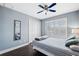 Bedroom with wood flooring, large window, and ceiling fan at 2601 Bay Blvd, Indian Rocks Beach, FL 33785