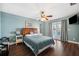 Serene bedroom with wood floors, ceiling fan and private access to balcony at 2601 Bay Blvd, Indian Rocks Beach, FL 33785
