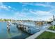 Private dock with multiple boat slips on a calm waterway at 2601 Bay Blvd, Indian Rocks Beach, FL 33785