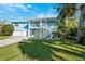 Two-story home, light blue exterior, double garage, balcony at 2601 Bay Blvd, Indian Rocks Beach, FL 33785