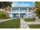 Two-story house with a wrap-around porch and walkway at 2601 Bay Blvd, Indian Rocks Beach, FL 33785