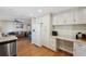 Eat-in kitchen with white cabinets, granite countertops, and a convenient workspace at 2601 Bay Blvd, Indian Rocks Beach, FL 33785