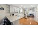 Modern kitchen with white cabinets, granite countertops, and a breakfast bar at 2601 Bay Blvd, Indian Rocks Beach, FL 33785