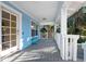 Spacious front porch with white railings and light blue walls at 2601 Bay Blvd, Indian Rocks Beach, FL 33785