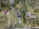 Aerial view of a home with solar panels and spacious yard at 34027 Saint Joe Rd, Dade City, FL 33525