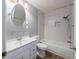 Clean bathroom with white vanity, bathtub, and tiled walls at 34027 Saint Joe Rd, Dade City, FL 33525
