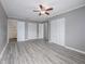 Spacious bedroom with wood-look floors and large closets at 34027 Saint Joe Rd, Dade City, FL 33525