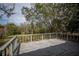 Wooden deck overlooking the backyard and trees at 34027 Saint Joe Rd, Dade City, FL 33525