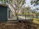 Wooden deck overlooks backyard with mature trees at 34027 Saint Joe Rd, Dade City, FL 33525