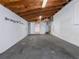 Garage with high ceilings, concrete floor, and workshop area at 34027 Saint Joe Rd, Dade City, FL 33525