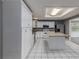 White kitchen with granite countertops and ample cabinet space at 34027 Saint Joe Rd, Dade City, FL 33525