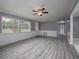 Living Room with wood-look floors and a ceiling fan at 34027 Saint Joe Rd, Dade City, FL 33525