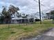 Ranch style home with a large yard and carport at 5 W Spanish Main St, Tampa, FL 33609