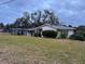 Single story home with a covered carport and large yard at 5 W Spanish Main St, Tampa, FL 33609