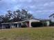 Single story home with a covered carport and large yard at 5 W Spanish Main St, Tampa, FL 33609