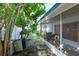 Backyard with a screened porch and lush landscaping at 604 Danube Ave, Tampa, FL 33606