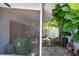 Small backyard with patio, storage, and tropical landscaping at 604 Danube Ave, Tampa, FL 33606