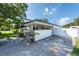 White brick home with carport and spacious driveway at 604 Danube Ave, Tampa, FL 33606
