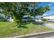 Large tree shades the front yard of this home at 604 Danube Ave, Tampa, FL 33606