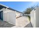 Backyard with patio, white fence, and access to garage at 7516 38Th N Ave, St Petersburg, FL 33710