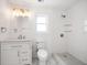 Clean bathroom with white vanity, toilet and shower at 7516 38Th N Ave, St Petersburg, FL 33710