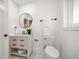 Modern bathroom with white vanity, toilet, and black accents at 7516 38Th N Ave, St Petersburg, FL 33710