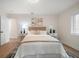 Cozy bedroom with a plush bed, neutral tones, and hardwood floors at 7516 38Th N Ave, St Petersburg, FL 33710