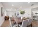 Modern dining room with a wood table and comfortable seating for six at 7516 38Th N Ave, St Petersburg, FL 33710