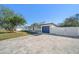 Beautiful house with a gray garage door and a paved driveway at 7516 38Th N Ave, St Petersburg, FL 33710