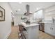 Updated kitchen with white cabinets, stainless steel appliances and an island at 7516 38Th N Ave, St Petersburg, FL 33710