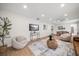 Bright living room features hardwood floors, comfy seating, and stylish decor at 7516 38Th N Ave, St Petersburg, FL 33710