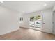 Bright living room with sliding doors opening to a view of a pool at 7516 38Th N Ave, St Petersburg, FL 33710