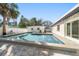 Elevated view of refreshing pool with patio and palm trees at 7516 38Th N Ave, St Petersburg, FL 33710